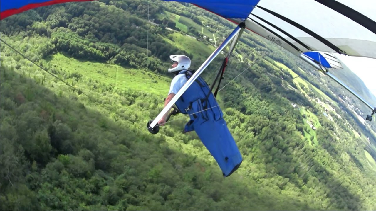 The man's doing Hang gliding