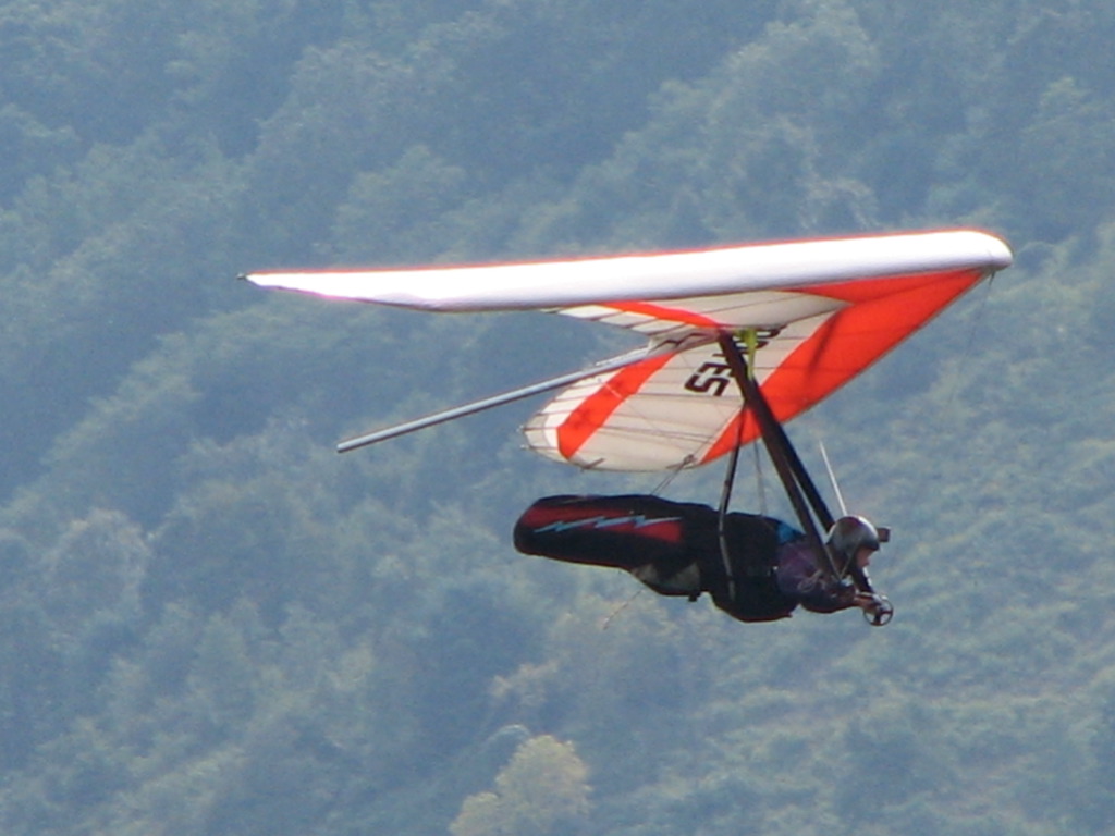 A man flying a hang glider