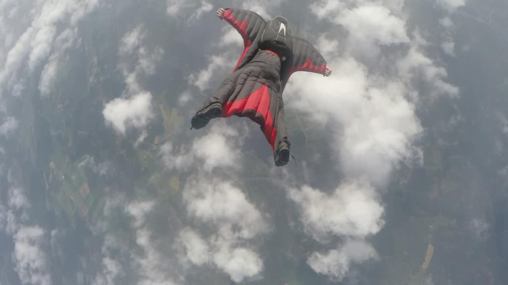 Man in Black and  Red Wingsuit