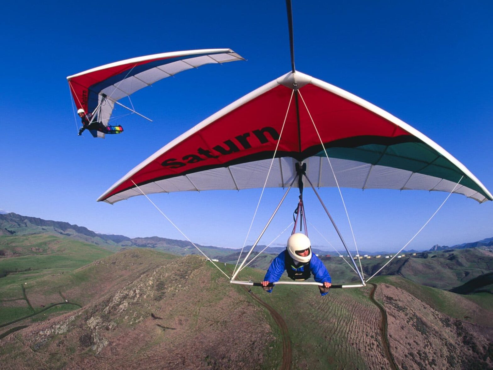 People Flying on Hang Gliders